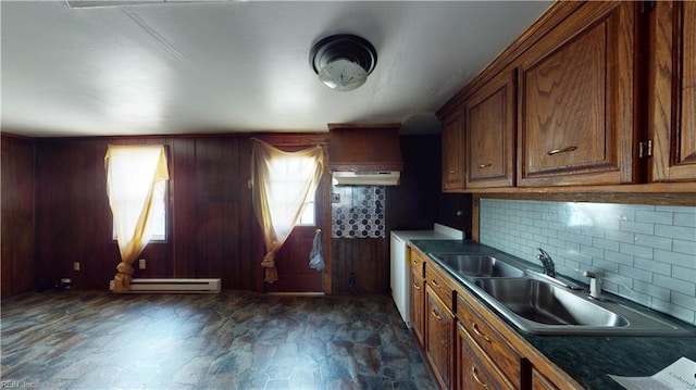 kitchen featuring sink, backsplash, and a baseboard radiator