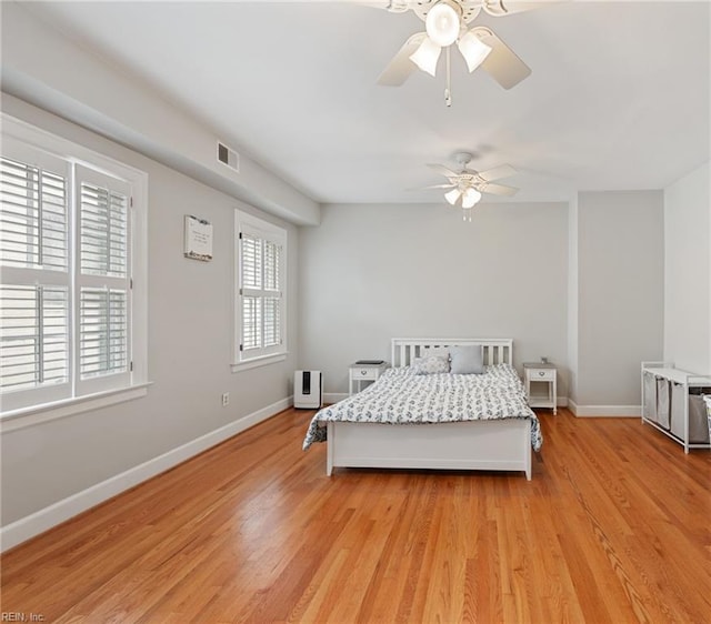 bedroom featuring light hardwood / wood-style floors and ceiling fan