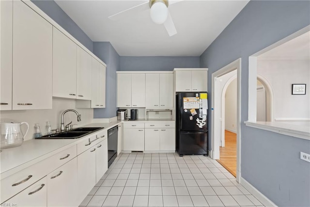 kitchen featuring black appliances, sink, white cabinetry, light hardwood / wood-style floors, and ceiling fan