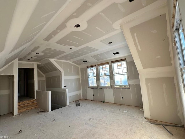 additional living space with vaulted ceiling