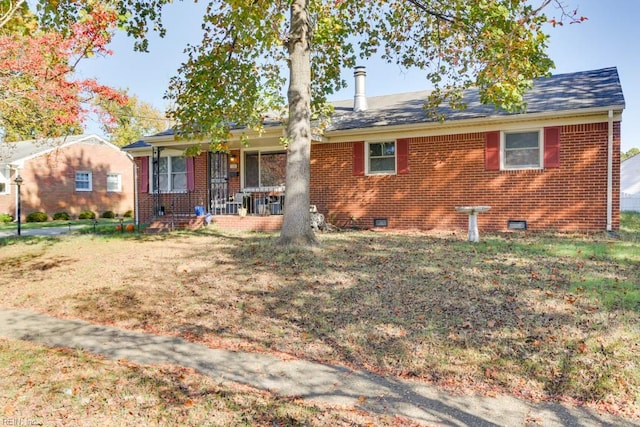 view of front of home with covered porch and a front yard