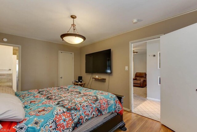 bedroom with light hardwood / wood-style floors