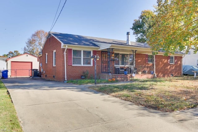 view of front of property with an outbuilding, a garage, and covered porch