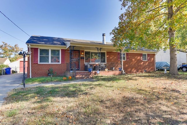 ranch-style home with a front lawn and covered porch