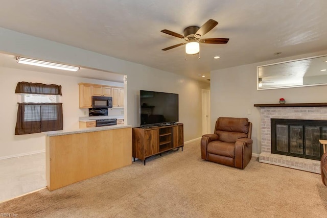 living room with light carpet, a fireplace, and ceiling fan