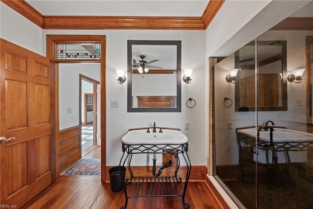 bathroom with hardwood / wood-style flooring, ceiling fan, and crown molding