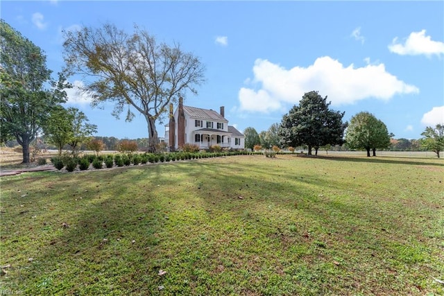 view of yard with a rural view