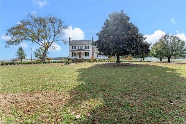 view of yard with a rural view