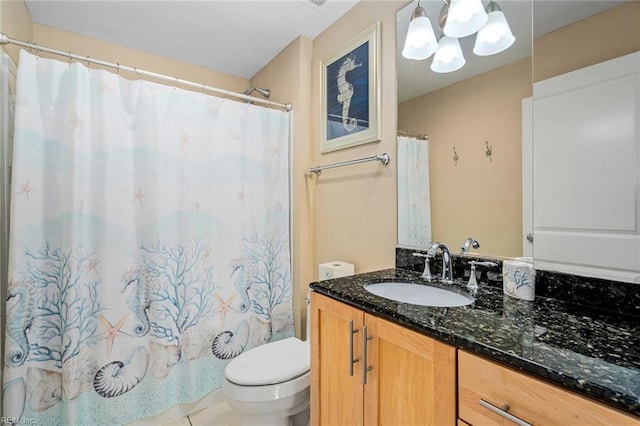 bathroom with vanity, curtained shower, toilet, and tile patterned flooring