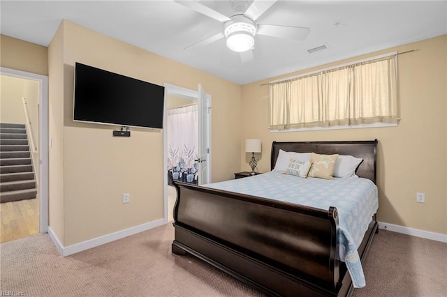 bedroom featuring ceiling fan and light colored carpet