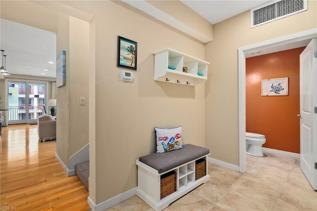 mudroom with light hardwood / wood-style floors