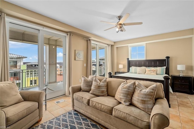 tiled bedroom with access to exterior and ceiling fan