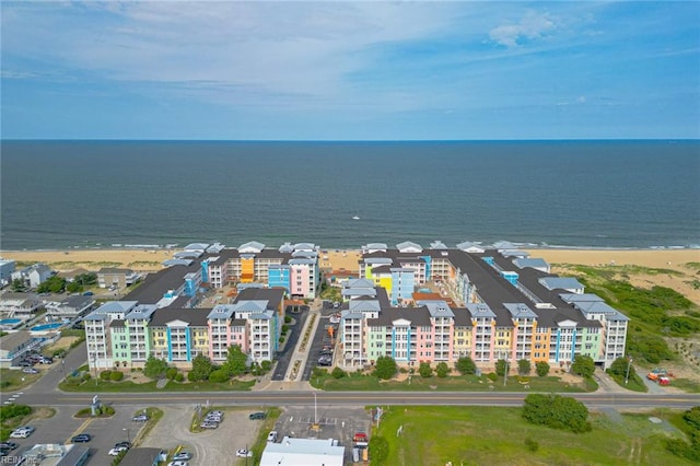 aerial view with a water view and a view of the beach