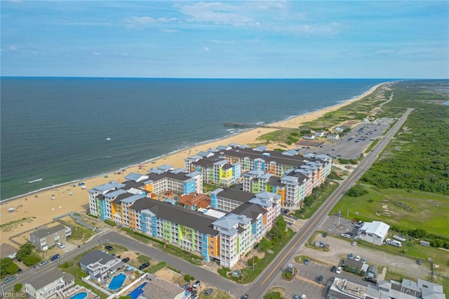 bird's eye view featuring a water view and a beach view