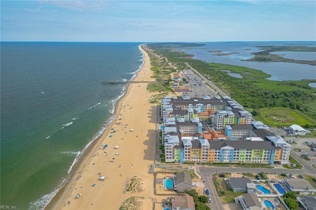 birds eye view of property featuring a water view and a view of the beach