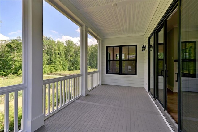 unfurnished sunroom featuring a wealth of natural light