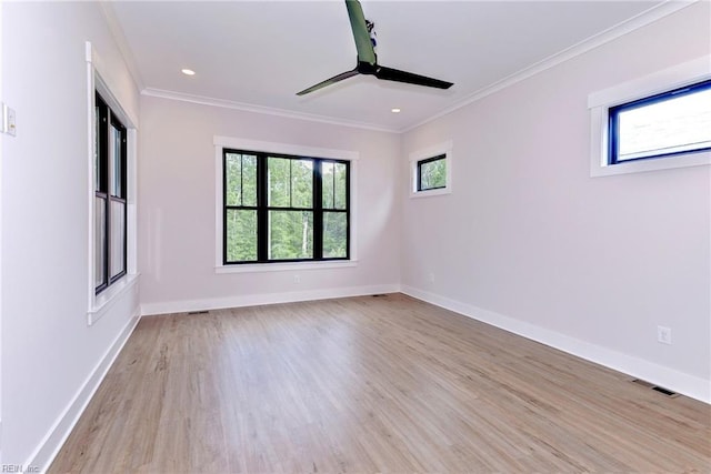 unfurnished room featuring ornamental molding, light wood-type flooring, and ceiling fan