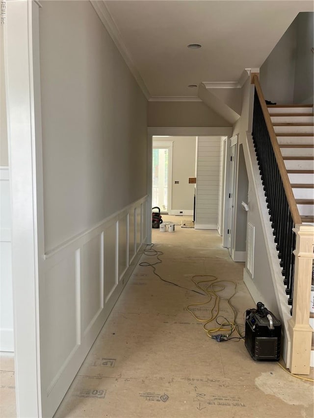 hall with ornamental molding and stairway