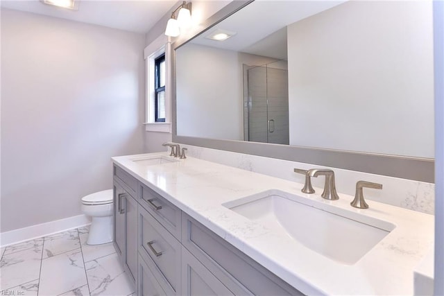 bathroom featuring vanity, toilet, and an enclosed shower