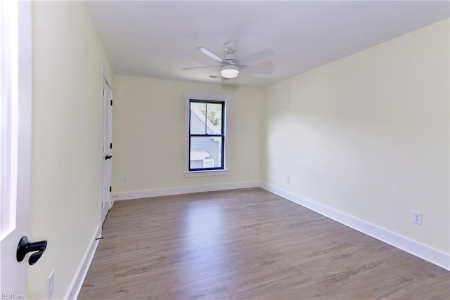 empty room featuring light hardwood / wood-style flooring and ceiling fan