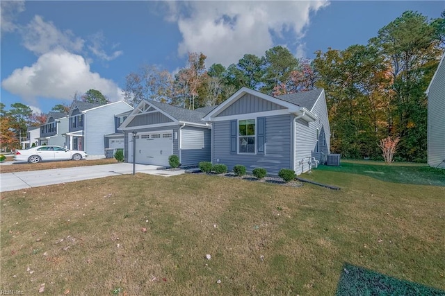 view of front of property featuring a front yard, central AC unit, and a garage