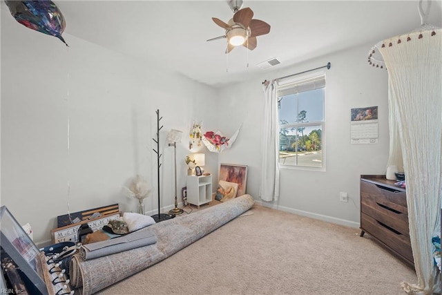 bedroom with ceiling fan and light carpet