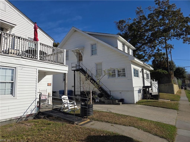 rear view of house with central air condition unit