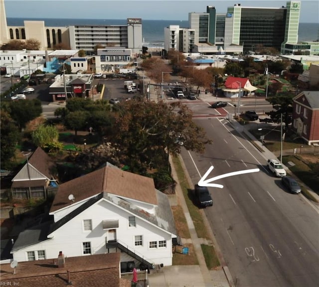 birds eye view of property with a water view