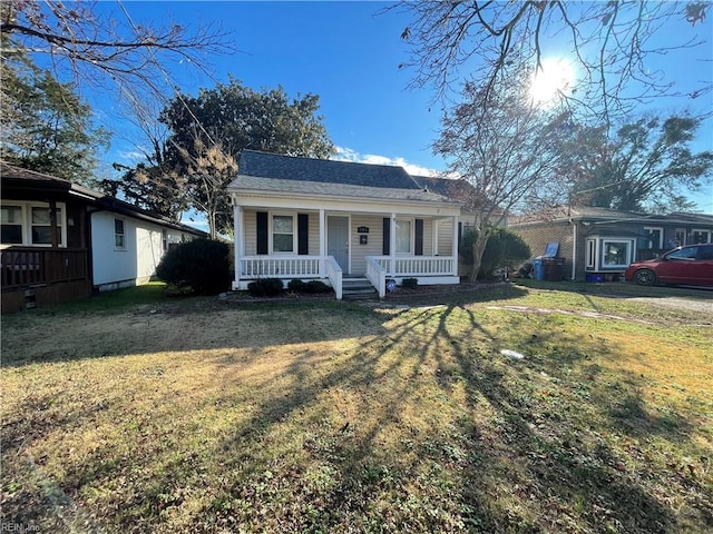 view of front of property with a front yard and a porch