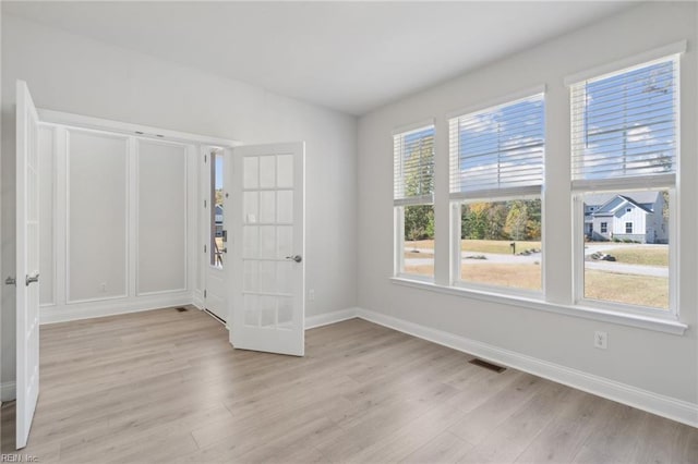 foyer entrance featuring light wood-type flooring