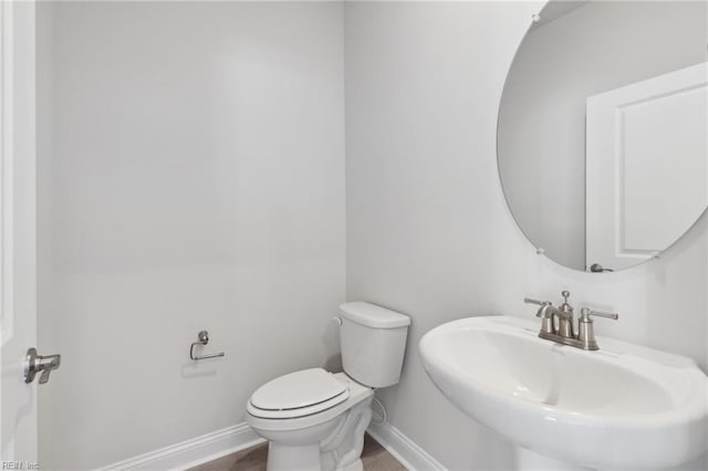 bathroom with toilet and sink