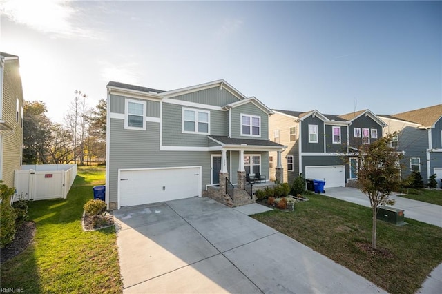 view of front of home with a front lawn and a garage