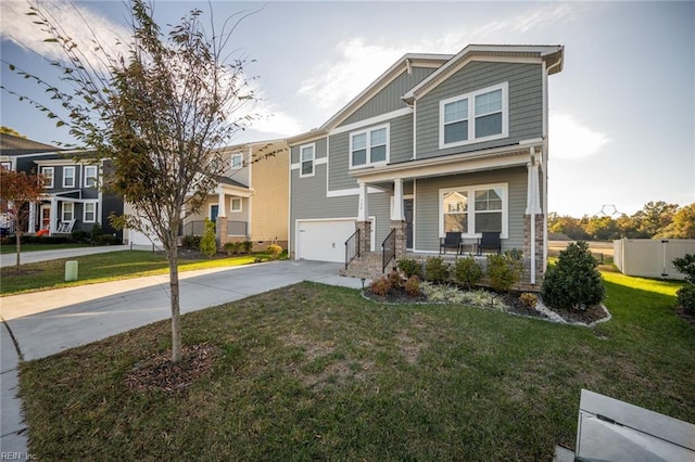 view of front of property featuring a porch, a front lawn, and a garage