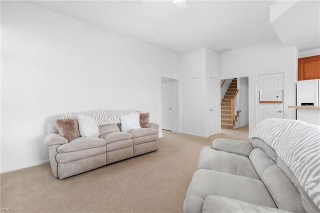 living room featuring light colored carpet