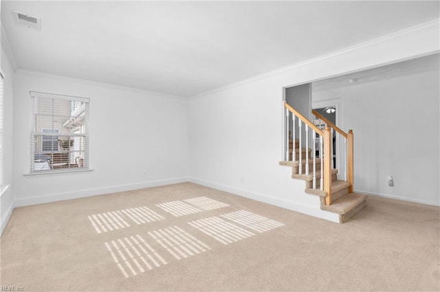 unfurnished room featuring ornamental molding and light colored carpet