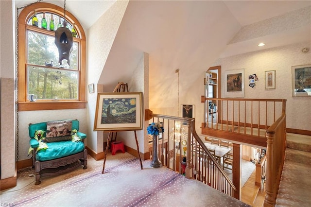 sitting room with lofted ceiling