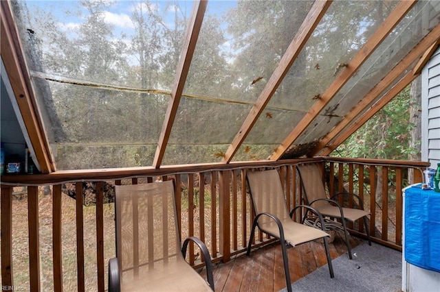 sunroom / solarium featuring lofted ceiling