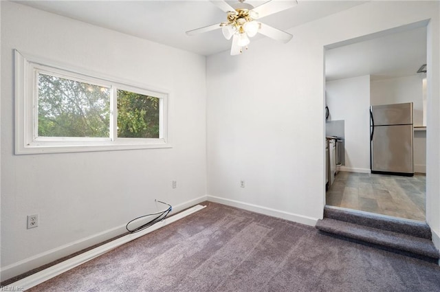 empty room featuring carpet floors and ceiling fan