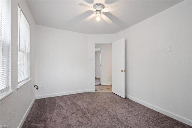 unfurnished room with carpet and ceiling fan