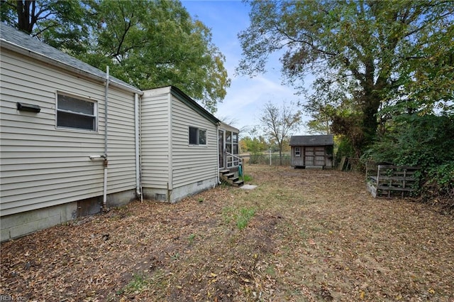 view of yard with a storage shed