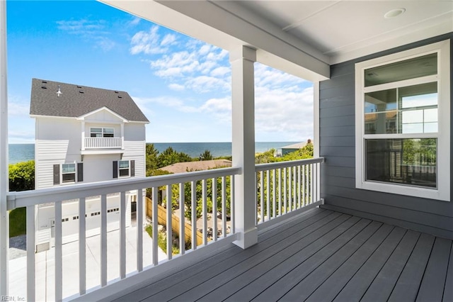 wooden deck with a water view