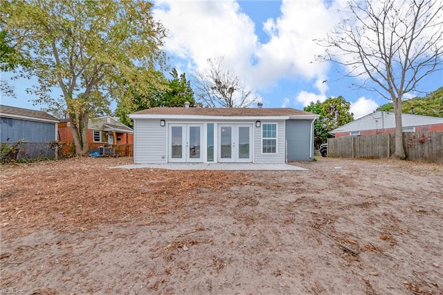 rear view of property with french doors