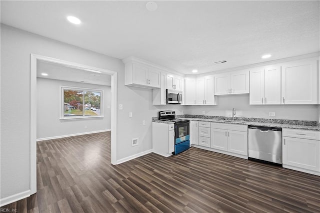 kitchen featuring white cabinetry, stainless steel appliances, and sink