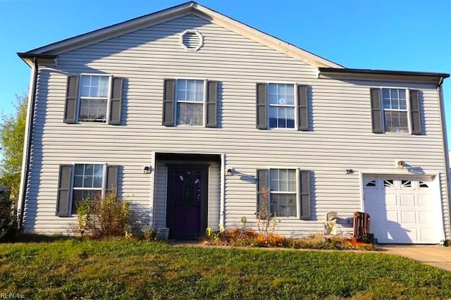 view of front of house with a garage and a front lawn