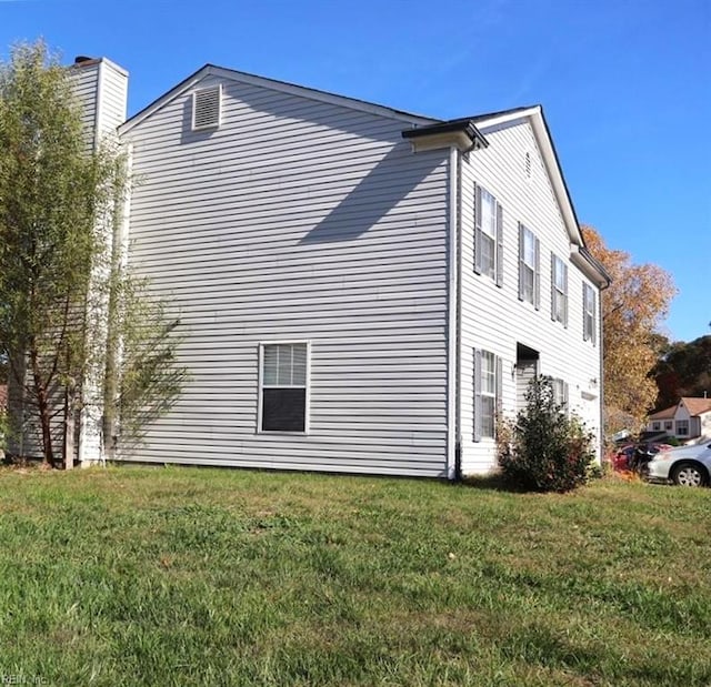 view of home's exterior featuring a yard