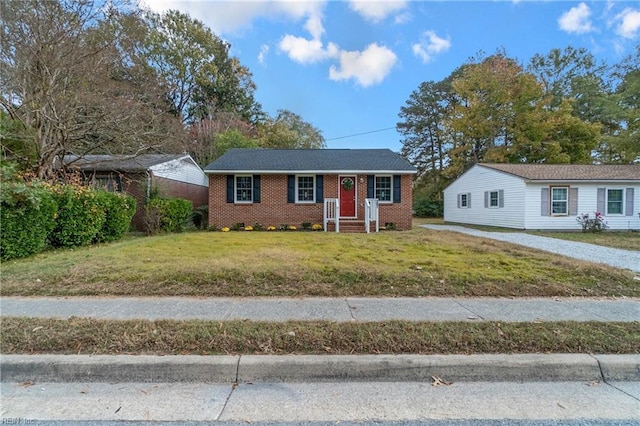 ranch-style home with a front lawn