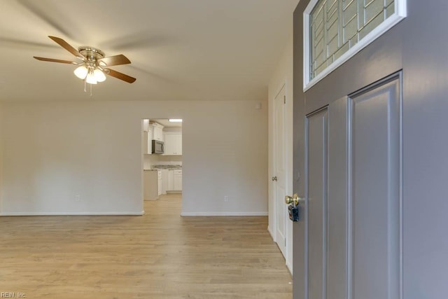 entryway featuring light hardwood / wood-style floors and ceiling fan