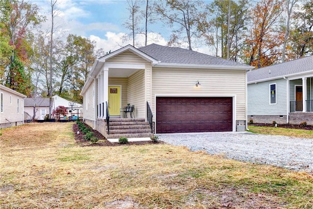 view of front facade with a garage and a front yard