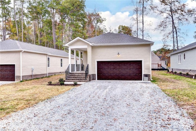 view of front of property with a garage and a front yard