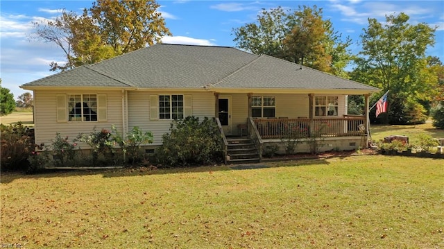 rear view of house featuring a wooden deck and a lawn